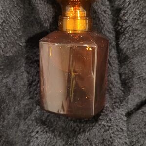 Fenty Beauty Gold and Brown Elegance Bottle